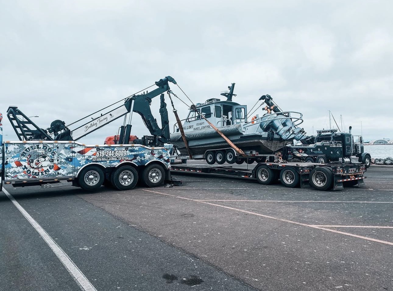 Bulldog Towing transporting a large marine vessel component using heavy-haul equipment.