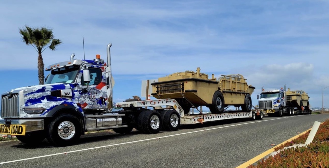 Bulldog Towing moving an oversize industrial load with properly configured heavy-duty transport trucks.